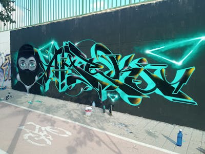 Black and Cyan Characters by AMEK. This Graffiti is located in Alicante, Spain and was created in 2022. This Graffiti can be described as Characters and Stylewriting.