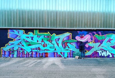 Cyan and Colorful and Violet Stylewriting by DON and TWA. This Graffiti is located in Lyon, France and was created in 2022. This Graffiti can be described as Stylewriting and Characters.