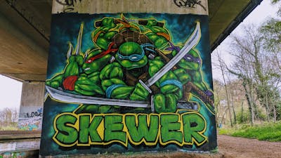 Green and Colorful Characters by SQWR. This Graffiti is located in London, United Kingdom and was created in 2023.