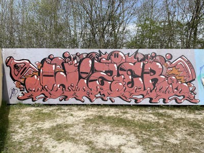 Black and Coralle Stylewriting by Wizer. This Graffiti is located in Kolding, Denmark and was created in 2023. This Graffiti can be described as Stylewriting, Wall of Fame and Characters.