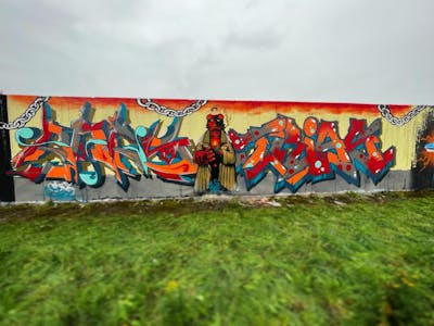 Colorful Stylewriting by Trias and ORES24. This Graffiti is located in Großenhain, Germany and was created in 2022. This Graffiti can be described as Stylewriting and Characters.