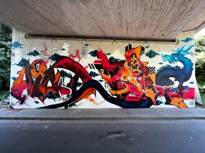 Orange and Blue Stylewriting by Moseg, Salzig, WickedOne and omseg. This Graffiti is located in Freiburg, Germany and was created in 2022. This Graffiti can be described as Stylewriting, Characters and Wall of Fame.
