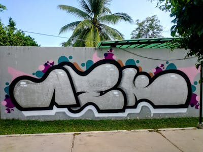 Chrome and Black Stylewriting by Aek. This Graffiti is located in Acapulco, Mexico and was created in 2022. This Graffiti can be described as Stylewriting and Street Bombing.