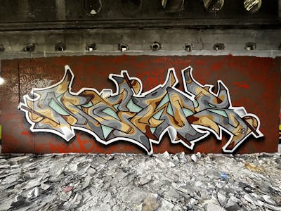 Grey and Brown and Colorful Stylewriting by News. This Graffiti is located in Walbrzych, Poland and was created in 2023.