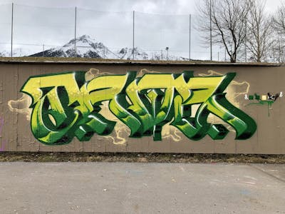 Green and Yellow and Light Green Stylewriting by TROZ ONE. This Graffiti is located in Imst, Austria and was created in 2024. This Graffiti can be described as Stylewriting and Wall of Fame.