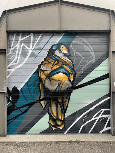 Cyan and Orange and Grey Characters by ARSONE. This Graffiti is located in Canada and was created in 2023.
