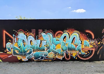 Cyan and Orange and Yellow Stylewriting by Mulog. This Graffiti is located in Lisboa, Portugal and was created in 2023.