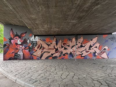 Colorful Stylewriting by omseg and Kosem. This Graffiti is located in Freiburg, Germany and was created in 2023. This Graffiti can be described as Stylewriting, Characters and Wall of Fame.