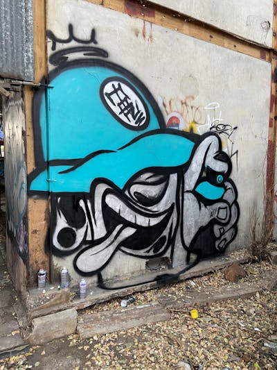 Cyan and Chrome Characters by Mons and TWDC. This Graffiti is located in Bangkok BKK, Thailand and was created in 2022. This Graffiti can be described as Characters and Abandoned.