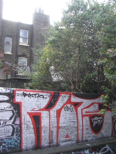 Chrome and Red Street Bombing by Riots. This Graffiti is located in London, United Kingdom and was created in 2009. This Graffiti can be described as Street Bombing and Stylewriting.