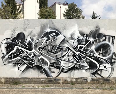 Grey Stylewriting by Thetan one. This Graffiti is located in Venezia, Italy and was created in 2021. This Graffiti can be described as Stylewriting and Wall of Fame.