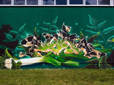 Light Green and Green Characters by Posa. This Graffiti is located in Greifswald, Germany and was created in 2021. This Graffiti can be described as Characters and Stylewriting.