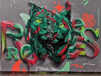 Cyan and Red Stylewriting by REVES ONE. This Graffiti is located in London, Netherlands and was created in 2022. This Graffiti can be described as Stylewriting, Characters and Wall of Fame.