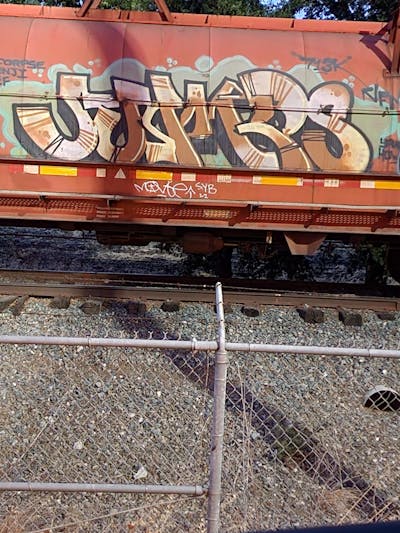 Brown and Beige Stylewriting by Jumps. This Graffiti is located in United States and was created in 2023. This Graffiti can be described as Stylewriting, Freights and Trains.