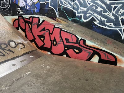 Red Stylewriting by IKOS. This Graffiti is located in Döbeln, Germany and was created in 2022. This Graffiti can be described as Stylewriting and Wall of Fame.