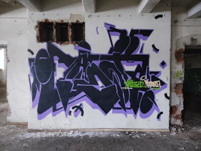 Black and Violet Stylewriting by MozgeR and IFanT. This Graffiti is located in Katowice, Poland and was created in 2024. This Graffiti can be described as Stylewriting and Abandoned.