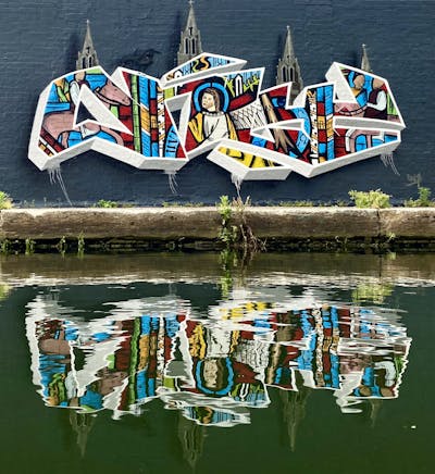 Colorful and White Stylewriting by Only E1. This Graffiti is located in London, United Kingdom and was created in 2021. This Graffiti can be described as Stylewriting, Characters, 3D and Wall of Fame.