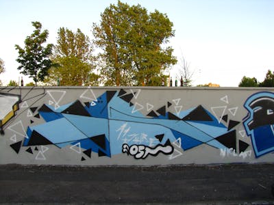 Light Blue and Grey Streetart by urine and KCF. This Graffiti is located in Delitzsch, Germany and was created in 2012.