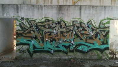 Cyan and Brown and Green Stylewriting by Gizmo. This Graffiti is located in Thessaloniki, Greece and was created in 2023. This Graffiti can be described as Stylewriting and Abandoned.