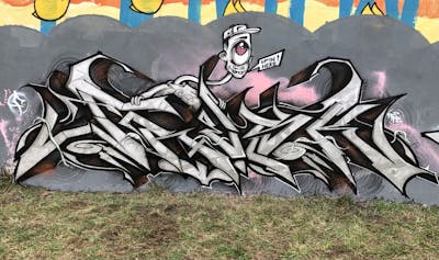 Grey and Chrome and Black Stylewriting by Fresk. This Graffiti is located in Warsaw, Poland and was created in 2023. This Graffiti can be described as Stylewriting, Characters and Wall of Fame.