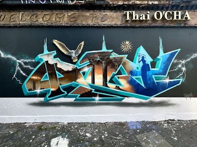 Colorful and Cyan Stylewriting by Only E1. This Graffiti is located in London, United Kingdom and was created in 2023. This Graffiti can be described as Stylewriting, Characters, Streetart and 3D.