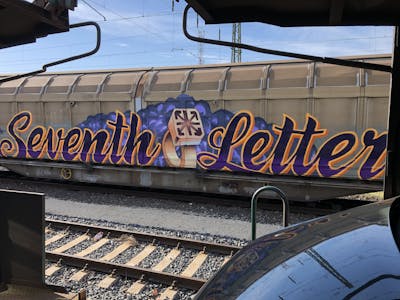 Violet and Orange and Beige Stylewriting by Fat Heat, Zoid and Transone. This Graffiti is located in Budapest, Hungary and was created in 2022. This Graffiti can be described as Stylewriting, Trains and Freights.