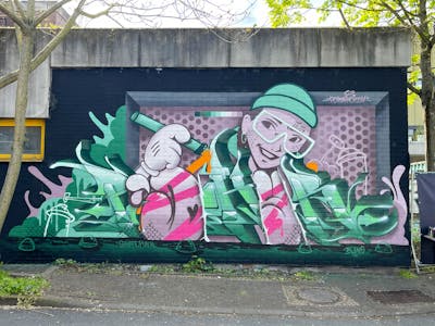Green and Light Green and Coralle Stylewriting by Pokar and Dizy. This Graffiti is located in Mainz, Germany and was created in 2023. This Graffiti can be described as Stylewriting, Characters, Wall of Fame and Murals.