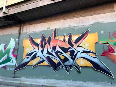 Light Blue and Orange Stylewriting by Kote. This Graffiti is located in Prato, Italy and was created in 2022.
