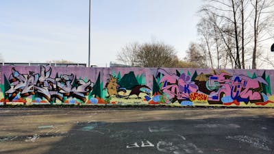 Colorful Stylewriting by Deki, AF-Crew and Eksot. This Graffiti is located in Wolfenbüttel, Germany and was created in 2024. This Graffiti can be described as Stylewriting, Characters and Wall of Fame.