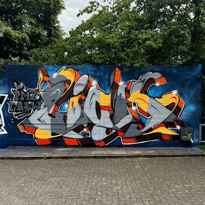 Grey and Orange and Blue Stylewriting by ZICK and PMZ CREW. This Graffiti is located in Oldenburg, Germany and was created in 2023.