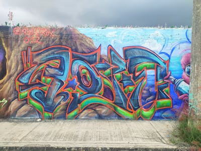 Colorful Stylewriting by Ron.e, ron.e.rox and O'12. This Graffiti is located in Playa del Carmen, Mexico and was created in 2022. This Graffiti can be described as Stylewriting, Characters and Wall of Fame.