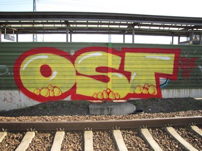 Red and Yellow Stylewriting by urine, Pizar and OST. This Graffiti is located in Leipzig, Germany and was created in 2010. This Graffiti can be described as Stylewriting and Line Bombing.