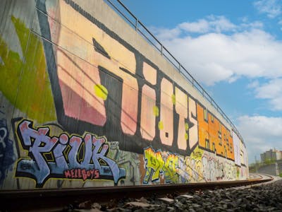 Colorful Stylewriting by Riots, OST, Hero, Piuk, Prof and kärn. This Graffiti is located in Leipzig, Germany and was created in 2011. This Graffiti can be described as Stylewriting, Roll Up and Line Bombing.