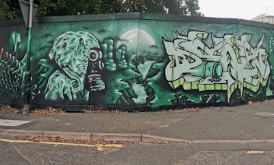 Cyan Stylewriting by Dkeg and dens. This Graffiti is located in Leeds, United Kingdom and was created in 2022. This Graffiti can be described as Stylewriting, Characters and Wall of Fame.