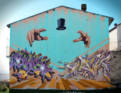 Colorful and Cyan Stylewriting by Zhanco, Rapone and Emeid. This Graffiti is located in Campobasso, Italy and was created in 2022. This Graffiti can be described as Stylewriting, Characters and Murals.
