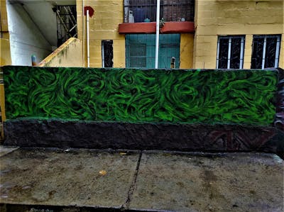 Green Streetart by Aek. This Graffiti is located in Acapulco, Mexico and was created in 2022.
