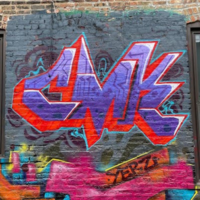 Violet and Red Stylewriting by CMK and ANGER. This Graffiti is located in Chicago, United States and was created in 2022. This Graffiti can be described as Stylewriting and Wall of Fame.