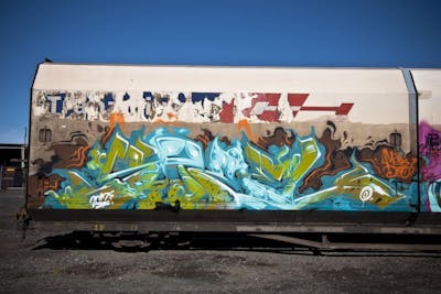 Cyan and Light Green and Light Blue Stylewriting by Askew and TMD. This Graffiti is located in New Zealand and was created in 2012. This Graffiti can be described as Stylewriting, Trains and Freights.