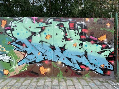 Cyan and Colorful Stylewriting by Intro. This Graffiti is located in Berlin, Germany and was created in 2023. This Graffiti can be described as Stylewriting and Wall of Fame.