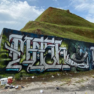 Chrome and Colorful Stylewriting by MOSH. This Graffiti is located in Kuala Lumpur, Malaysia and was created in 2021. This Graffiti can be described as Stylewriting and Characters.