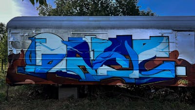 Light Blue and Blue and Brown Stylewriting by Dael. This Graffiti is located in Czech Republic and was created in 2022. This Graffiti can be described as Stylewriting and Cars.