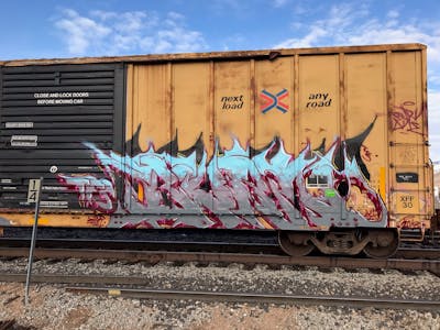 Grey and Light Blue Stylewriting by Burn. This Graffiti is located in United States and was created in 2020. This Graffiti can be described as Stylewriting, Freights and Trains.