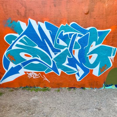 Orange and Light Blue Stylewriting by Swing, MCT and WBC. This Graffiti is located in Lyon, France and was created in 2022.