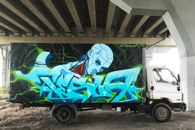 Light Blue and Colorful Cars by Tesla. This Graffiti is located in Saint-Petersburg, Russian Federation and was created in 2021. This Graffiti can be described as Cars, Stylewriting and Characters.