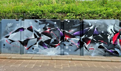 Grey and Red and Violet Stylewriting by SIDOK. This Graffiti is located in Eindhoven, Netherlands and was created in 2022. This Graffiti can be described as Stylewriting, Wall of Fame and Futuristic.
