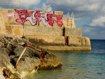 Red and Coralle Stylewriting by Riots. This Graffiti is located in Malta and was created in 2011. This Graffiti can be described as Stylewriting and Street Bombing.