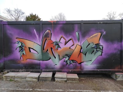 Grey and Violet and Orange Stylewriting by Dj Dookie and WKS. This Graffiti is located in Bielefeld, Germany and was created in 2022.