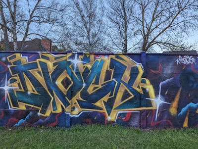 Yellow and Colorful and Blue Stylewriting by Dock and LORD. This Graffiti is located in Caen, France and was created in 2023.