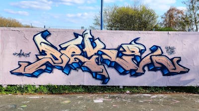 Beige and Blue Stylewriting by Deki and AF Crew. This Graffiti is located in Wolfenbüttel, Germany and was created in 2023. This Graffiti can be described as Stylewriting and Wall of Fame.