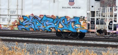 Light Blue Stylewriting by Sabot. This Graffiti is located in United States and was created in 2024. This Graffiti can be described as Stylewriting, Trains and Freights.